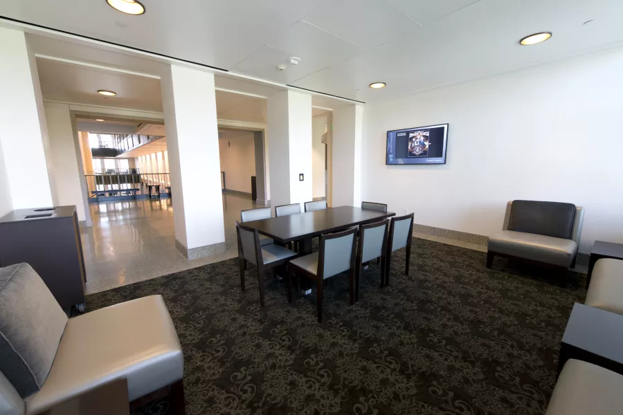 View of 2nd floor lounge with table and chairs