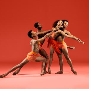 3 male dancers and a female dancer in orange costumes against a red-orange background